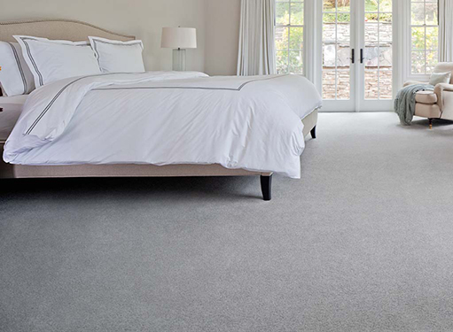 Bedroom scene with light gray Stainmaster carpet